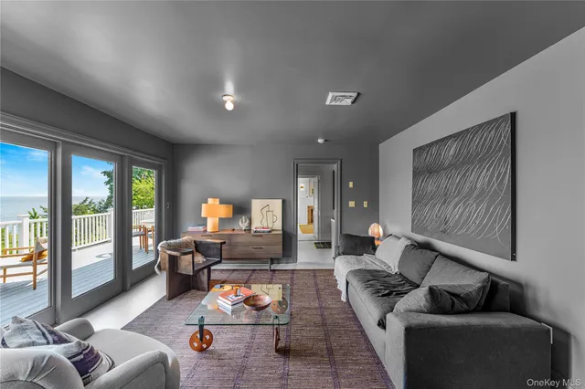 a spacious bedroom with a bed and a couch