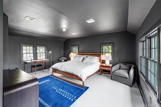 a bedroom with a bed and a table in it