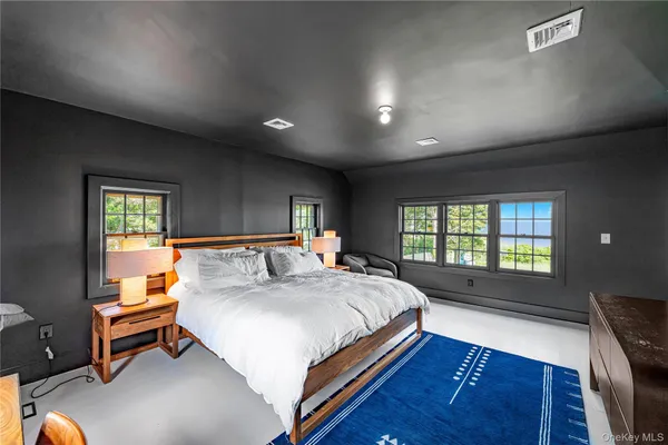 a view of a balcony with lake view and a floor to ceiling window