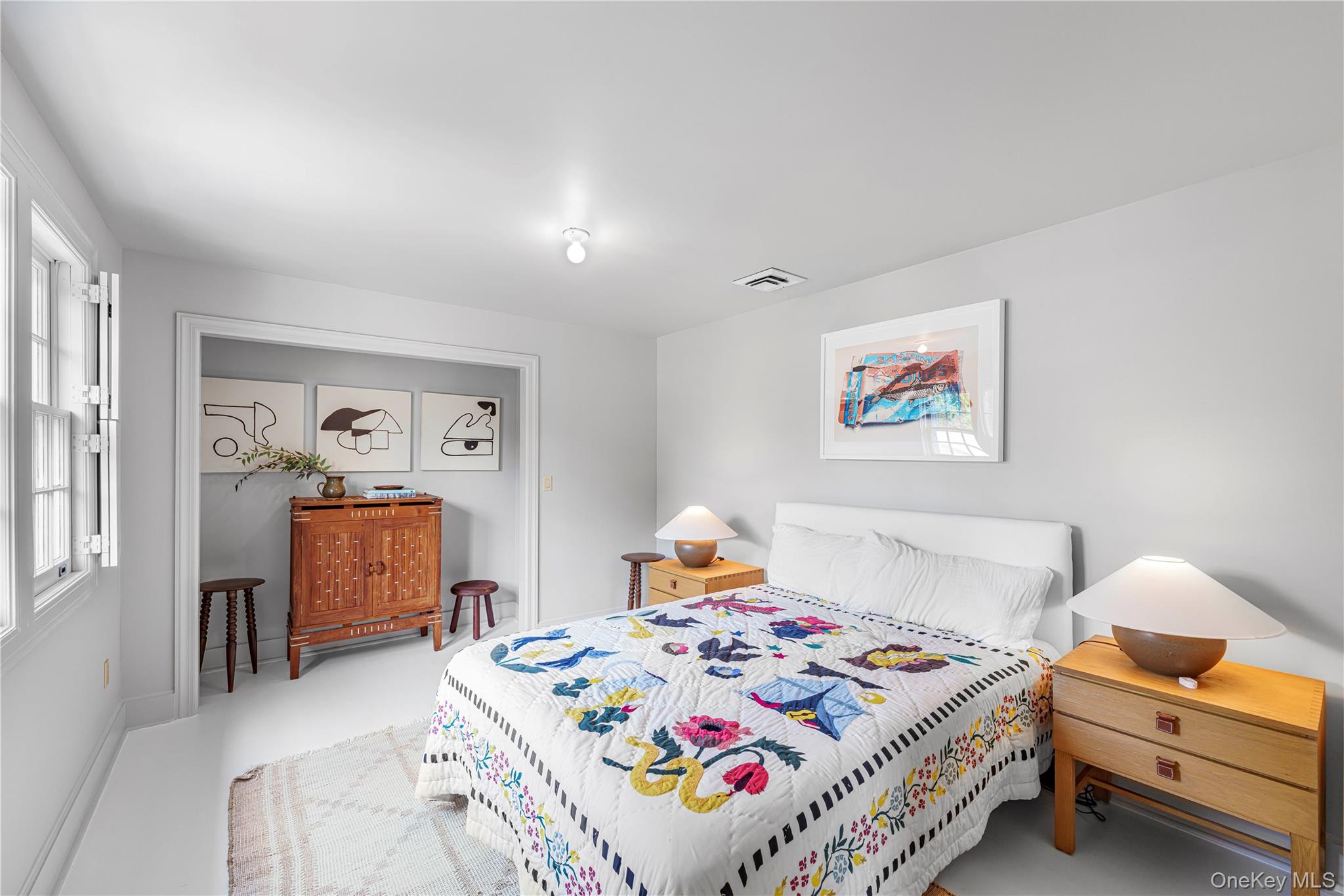 5 Thorn Hedge Road Bellport, NY 11713 - Photo 29 of 42 a bedroom with a bed and dresser