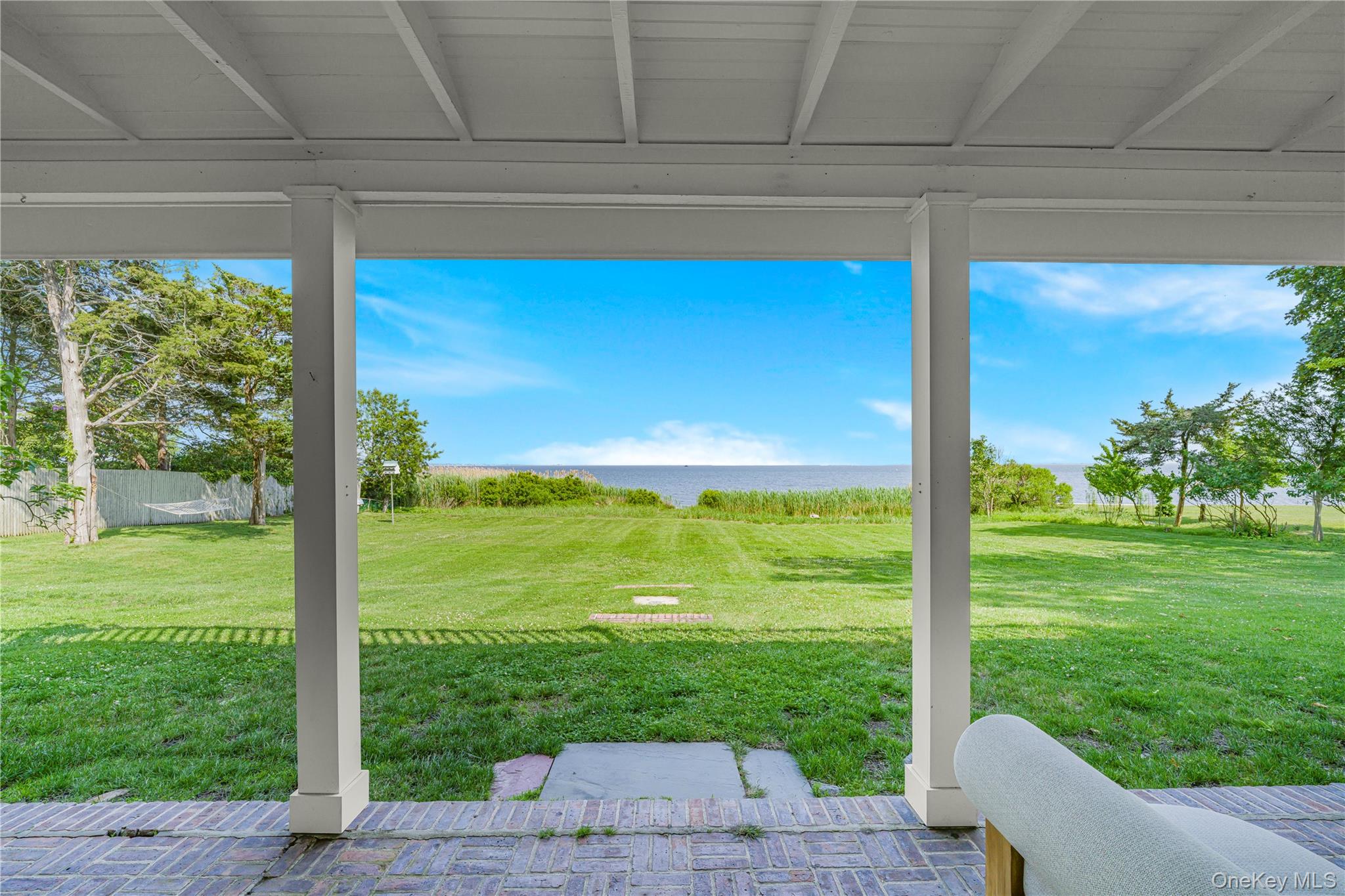5 Thorn Hedge Road Bellport, NY 11713 - Photo 32 of 42 a view of a porch with a yard