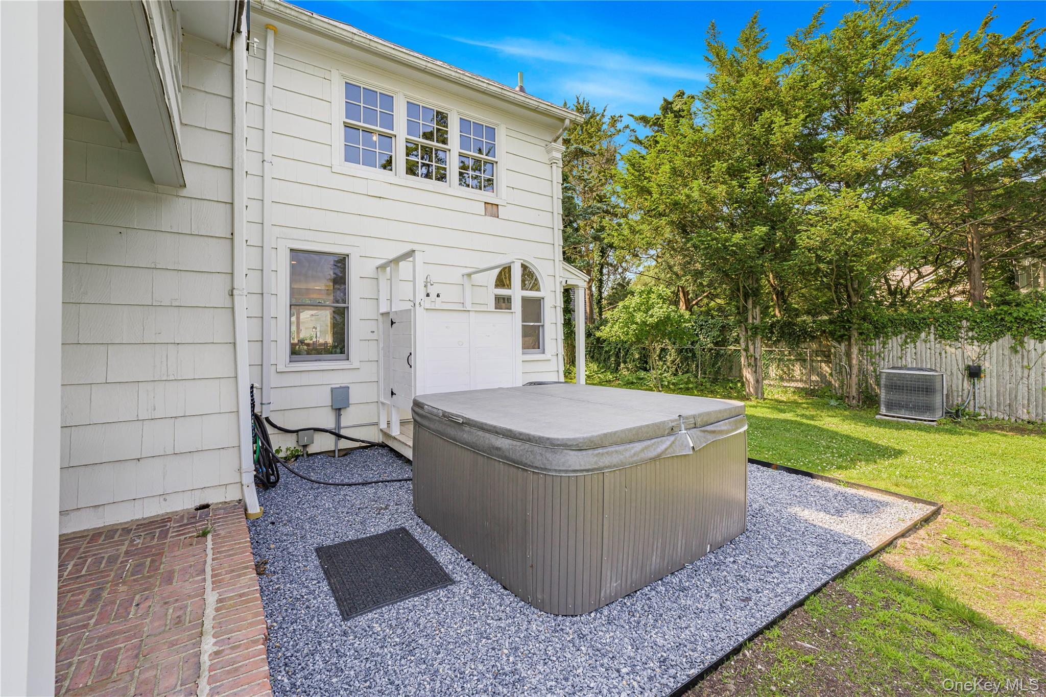 5 Thorn Hedge Road Bellport, NY 11713 - Photo 34 of 42 a view of a house with a yard