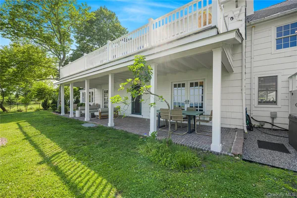a bathroom with a toilet sink vanity and mirror