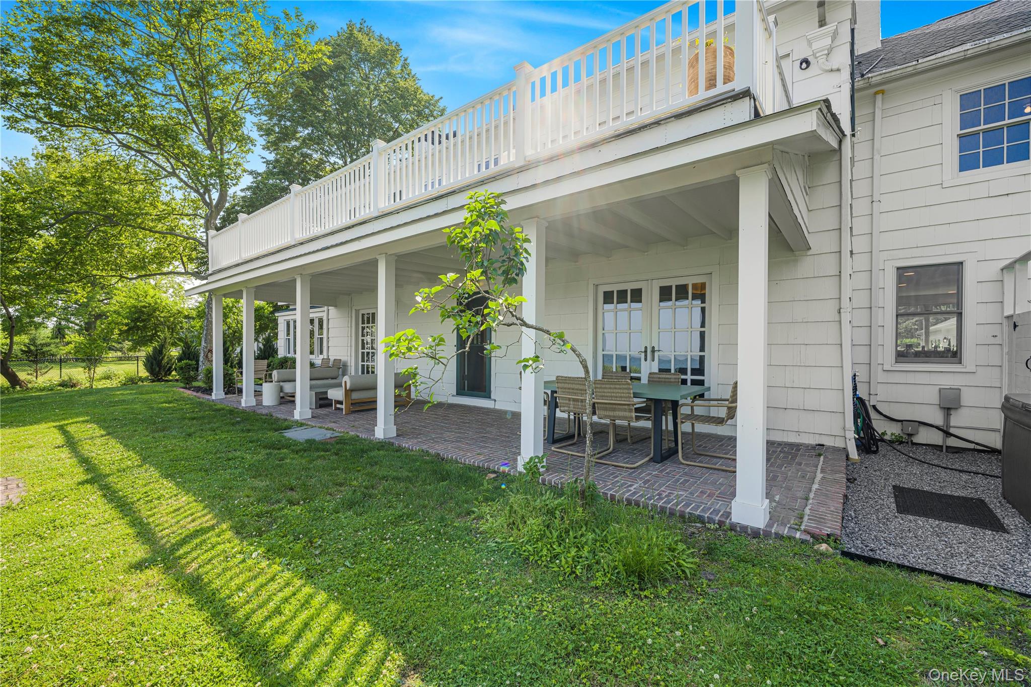 5 Thorn Hedge Road Bellport, NY 11713 - Photo 36 of 42 a view of a house with backyard porch and sitting area