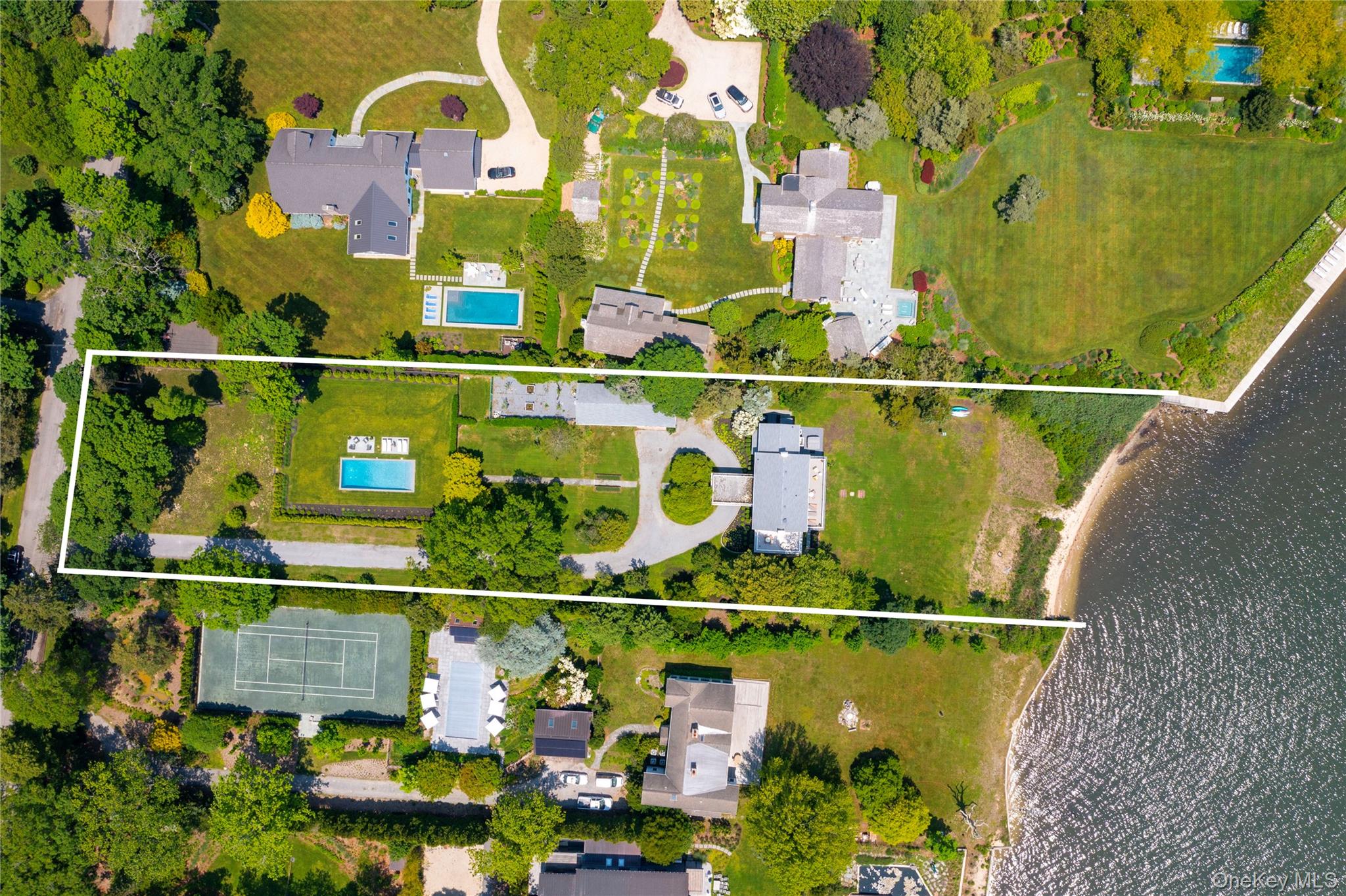 5 Thorn Hedge Road Bellport, NY 11713 - Photo 41 of 42 a view of swimming pool with a garden