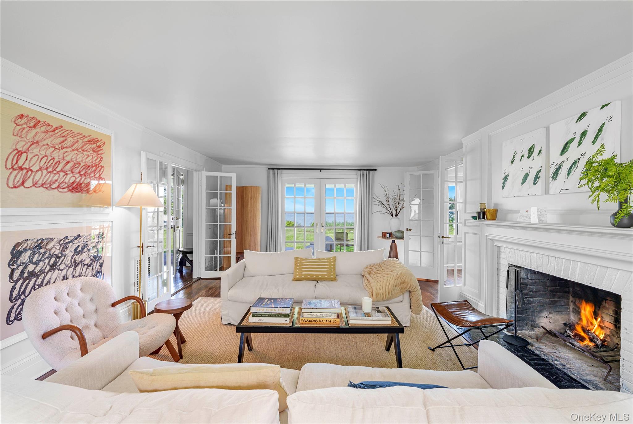 5 Thorn Hedge Road Bellport, NY 11713 - Photo 7 of 42 a living room with furniture fireplace and a large window