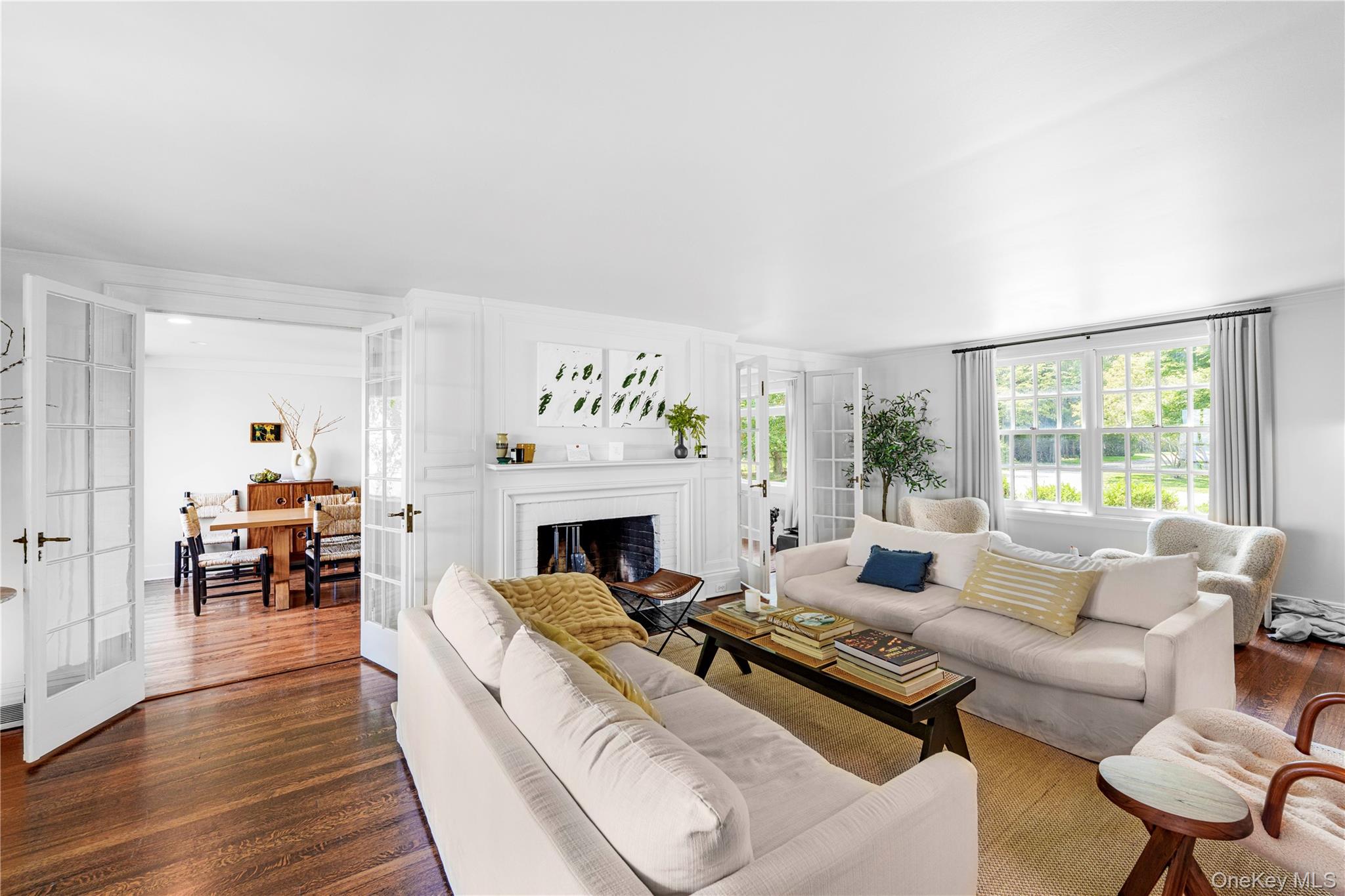 5 Thorn Hedge Road Bellport, NY 11713 - Photo 9 of 42 a living room with furniture fireplace and a table