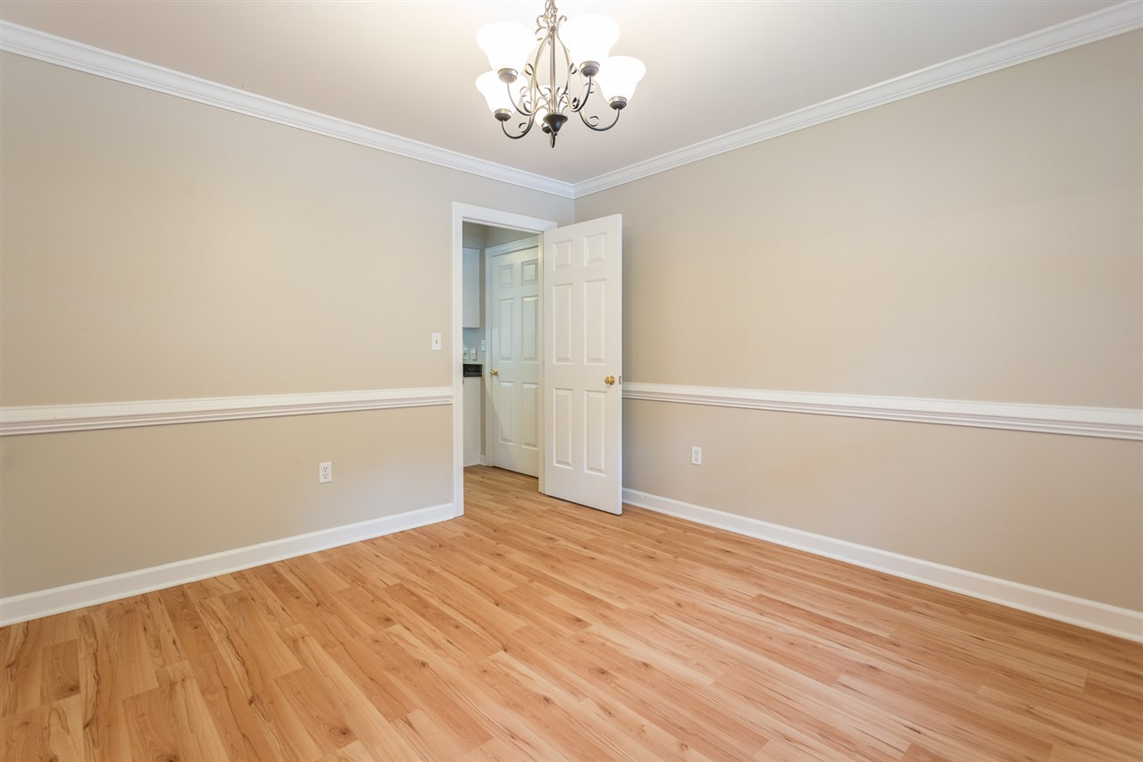 8805 Life Lane Raleigh, NC 27615 - Photo 6 of 28 Plantation shutters, chair railing and crown moulding Huge Dining Room