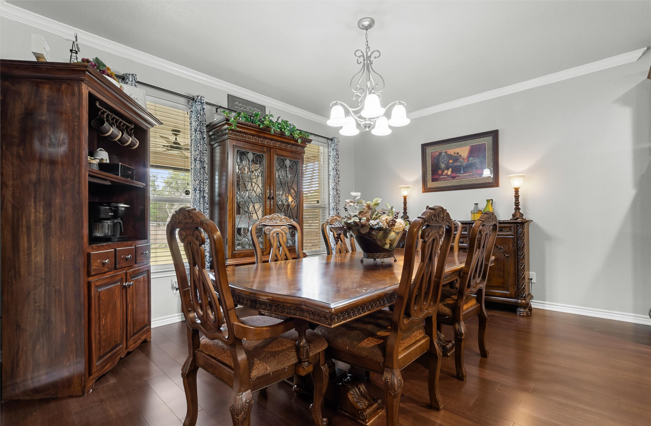 16017 Toby Court Temple, TX 76502 - Photo 6 of 33 Dining area with crown molding, dark wood-style floors, and a chandelier