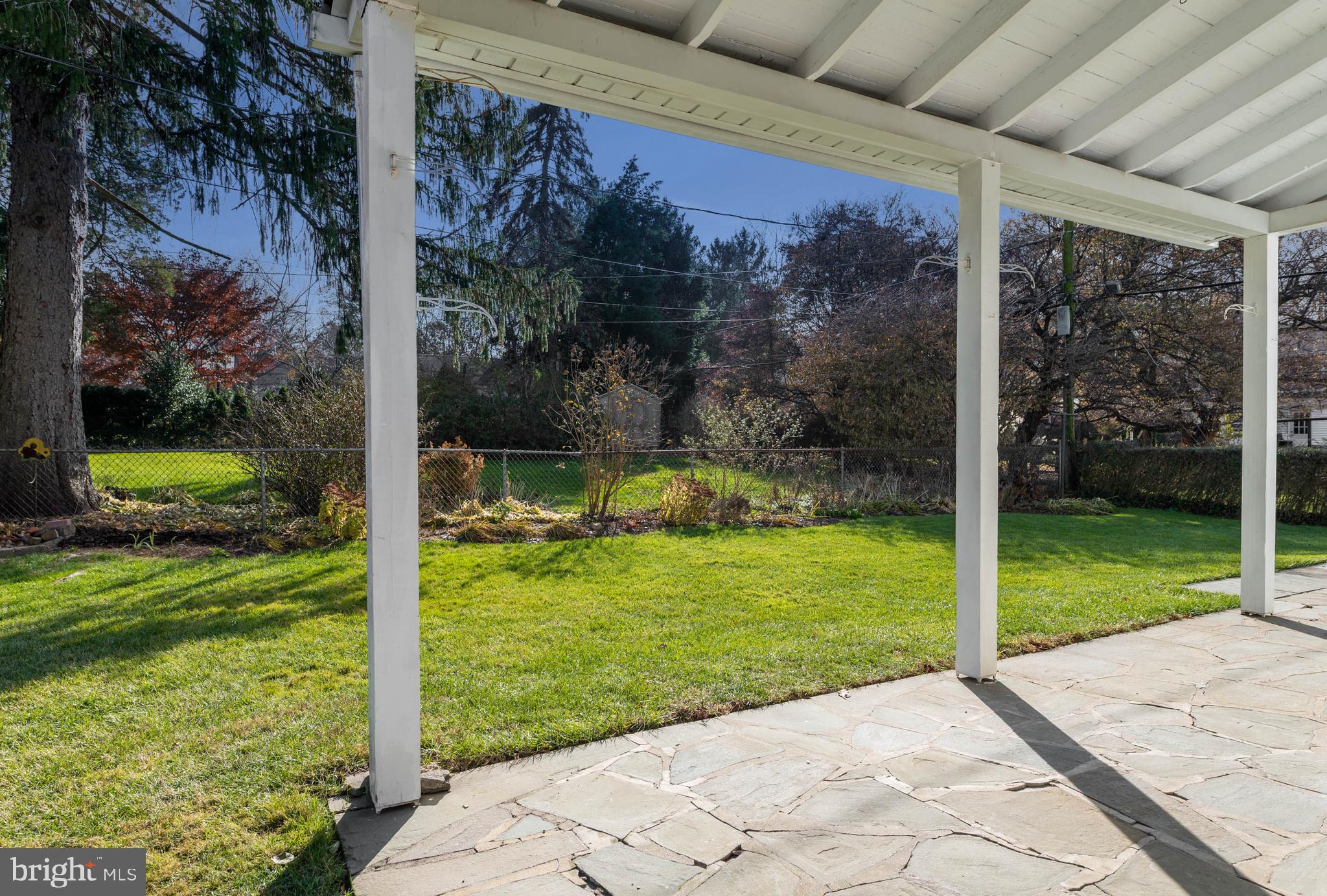 405 Sugartown Road Wayne, PA 19087 - Photo 21 of 25 Covered Back Patio and Garden View