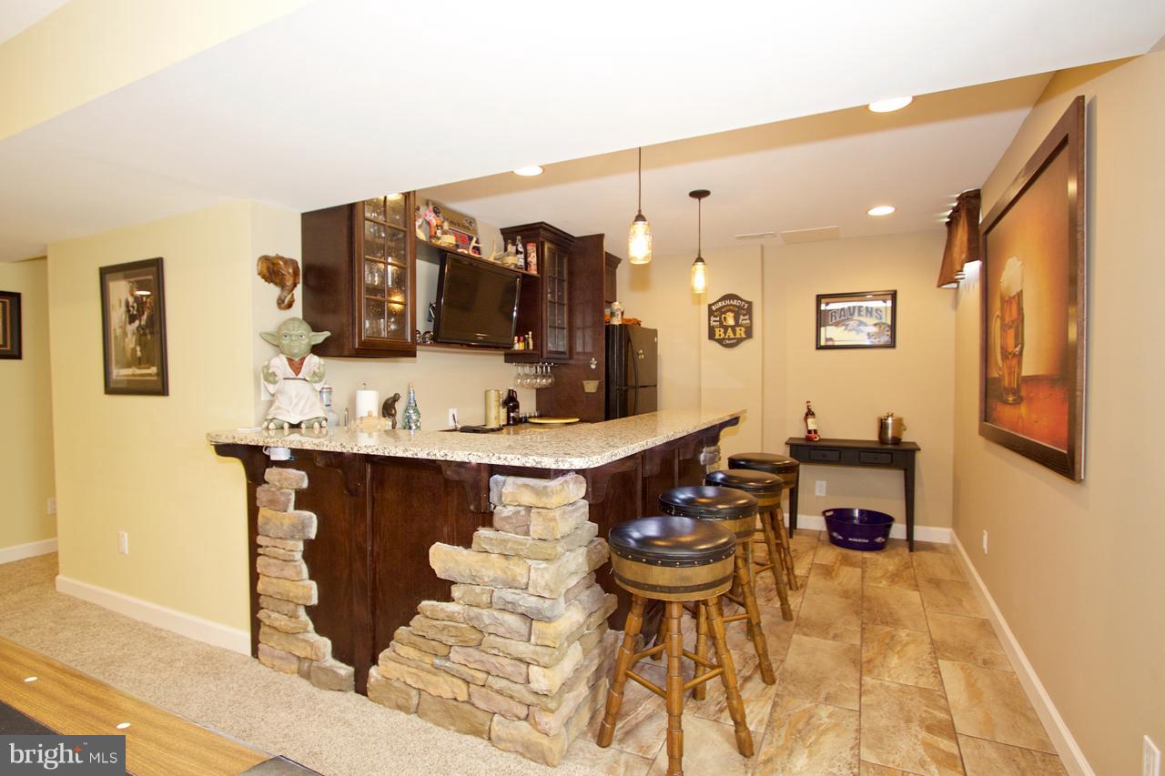 425 Spry Island Road Joppa, MD 21085 - Photo 17 of 30 Basement bar with great lighting!