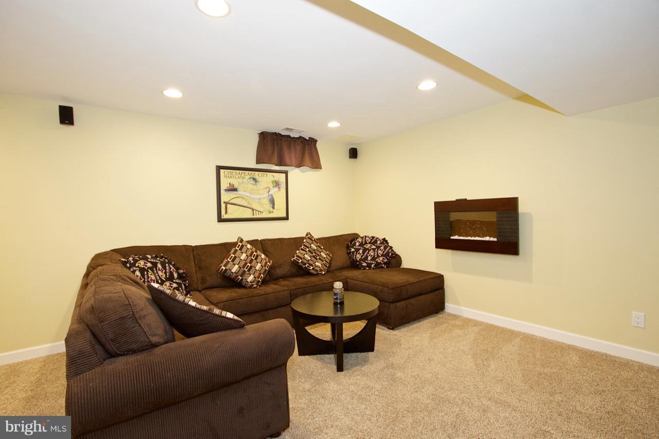 425 Spry Island Road Joppa, MD 21085 - Photo 18 of 30 Finished Basement with wall decorative fireplace