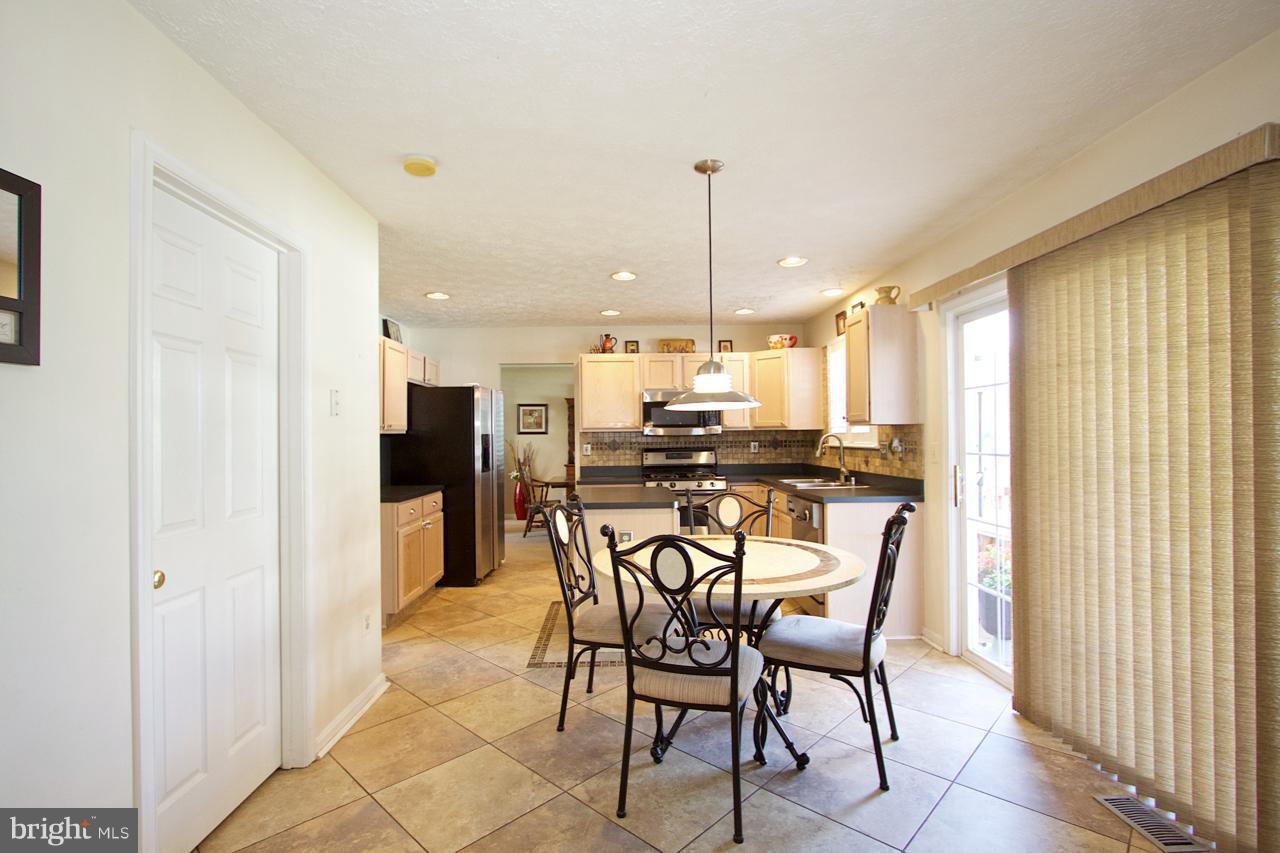 425 Spry Island Road Joppa, MD 21085 - Photo 10 of 30 Kitchen with tiled flooring and eat in area.