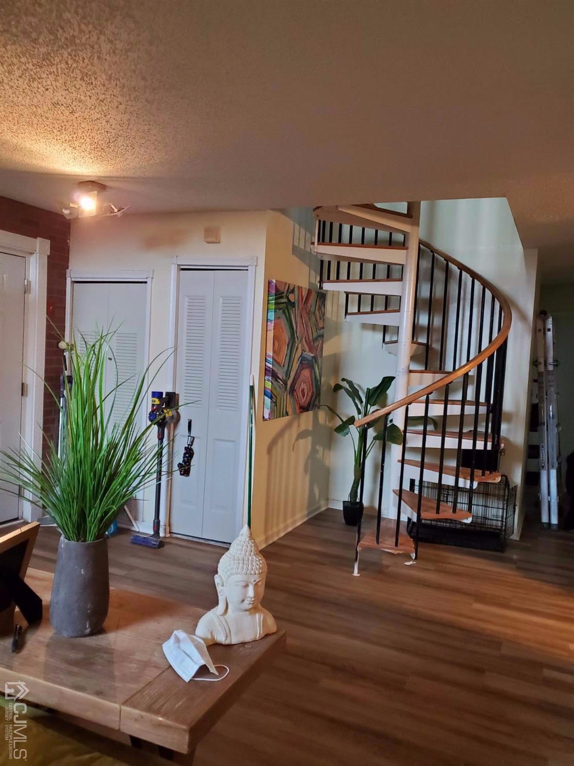 233 Edpas Road, Unit 233 New Brunswick, NJ 08901 - Photo 13 of 21 a view of a livingroom with furniture and wooden floor