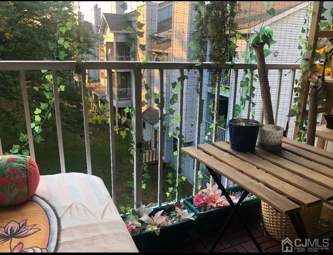 233 Edpas Road, Unit 233 New Brunswick, NJ 08901 - Photo 20 of 21 a balcony with furniture and garden view