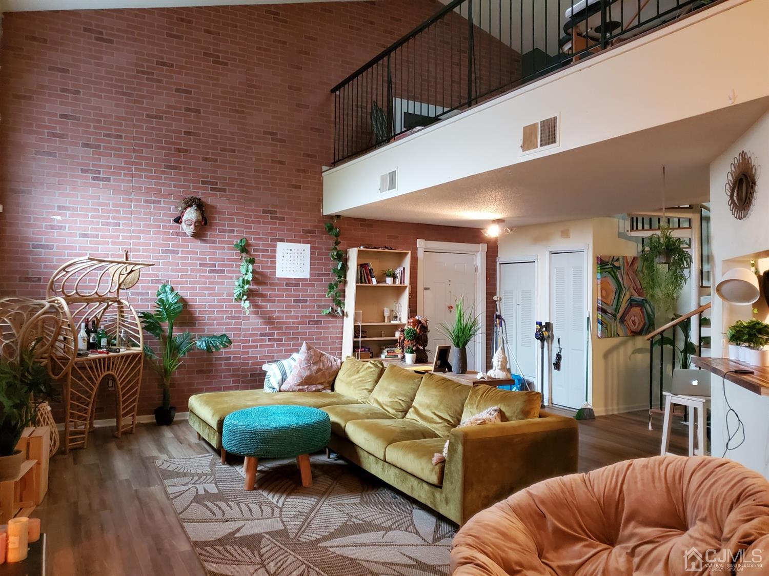 233 Edpas Road, Unit 233 New Brunswick, NJ 08901 - Photo 5 of 21 a outdoor living space with furniture and a couch