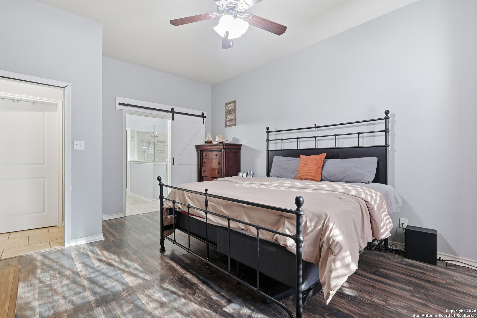 345 Morgan Run Cibolo, TX 78108 - Photo 11 of 22 a bedroom with a bed and a chandelier
