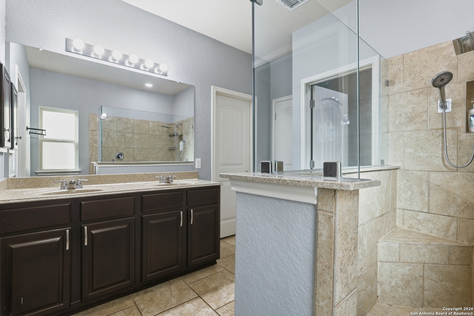 345 Morgan Run Cibolo, TX 78108 - Photo 12 of 22 a bathroom with a double vanity sink mirror and double