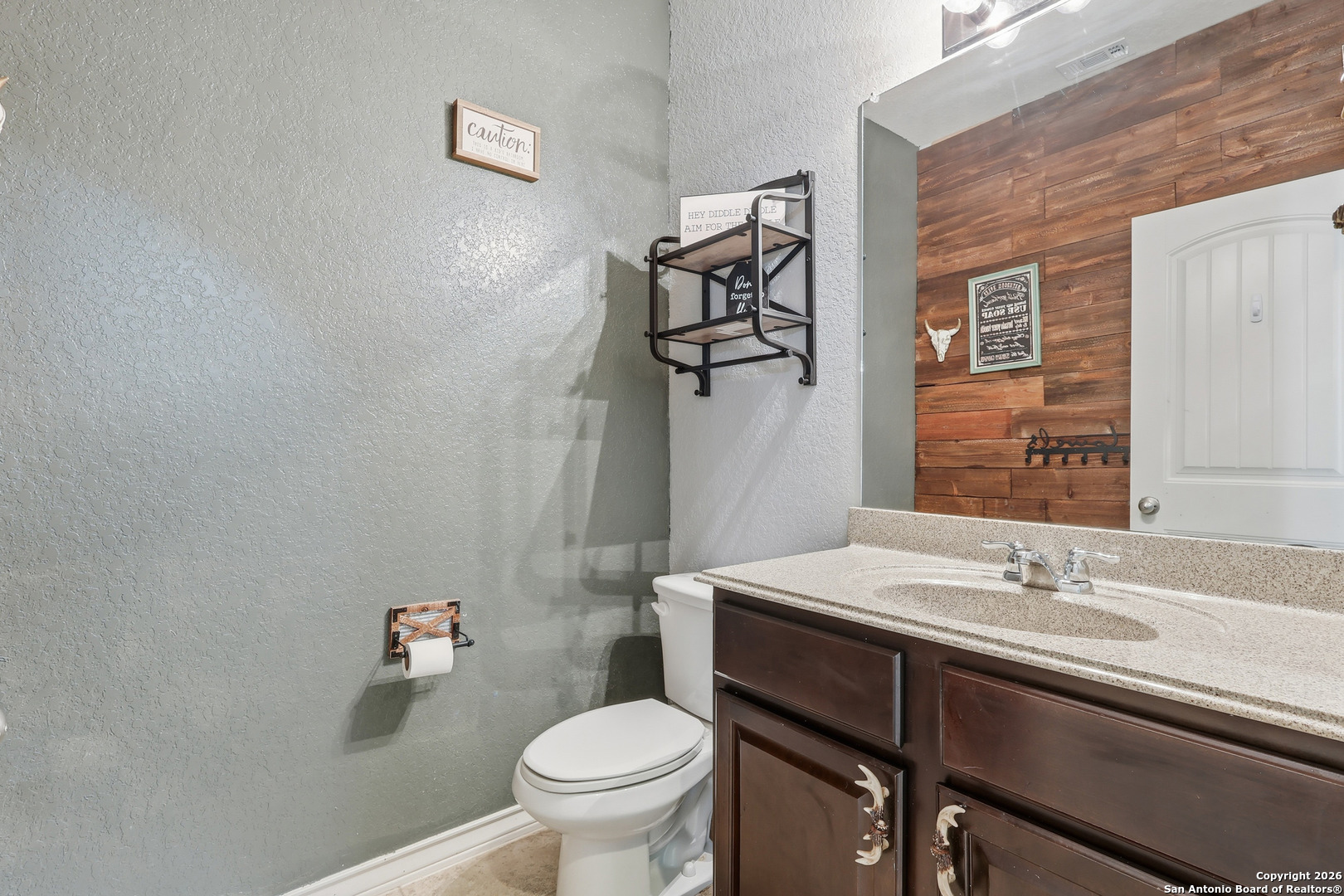 345 Morgan Run Cibolo, TX 78108 - Photo 9 of 22 a bathroom with a sink and a toilet