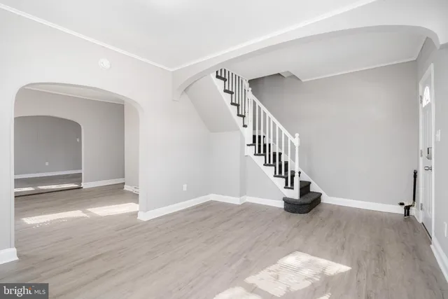a view of an entryway with wooden floor