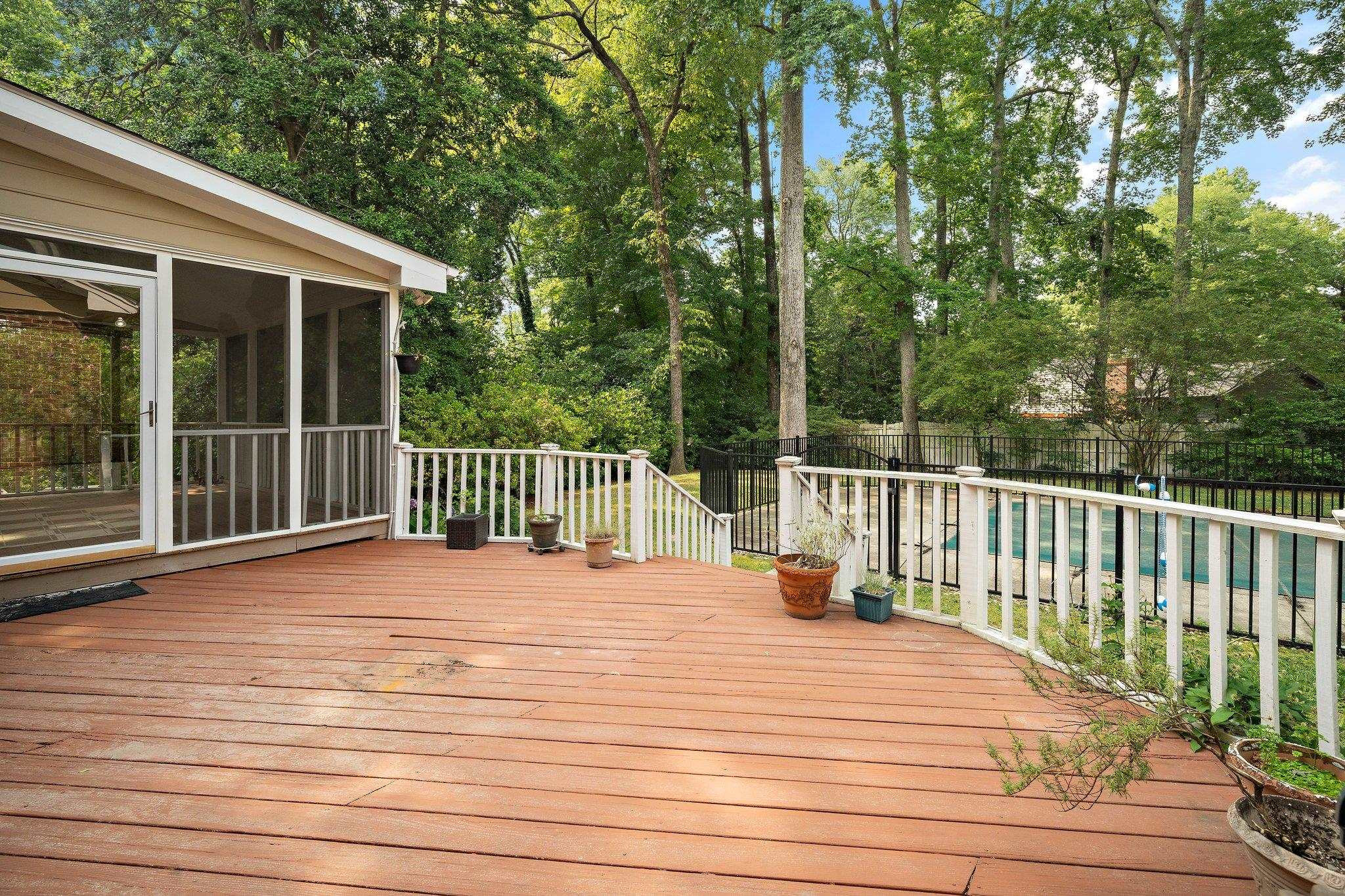 1512 Pony Run Road Raleigh, NC 27615 - Photo 28 of 39 Tranquility Abounds -- Spacious 21x14 Deck overlooks an Amazing Backyard with Mature Trees -- A Great Space to Entertain Family and Friends Deck