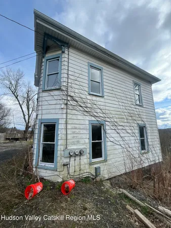 a view of a backyard of a house