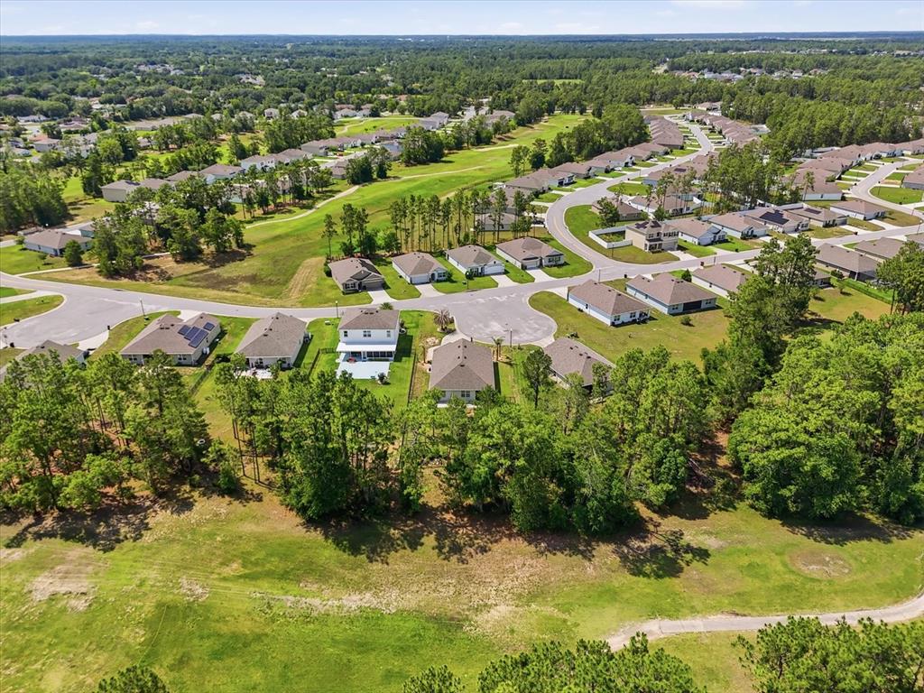 660 Hickory Course Loop Ocala, FL 34472 - Photo 45 of 45 an aerial view of residential houses with outdoor space and trees