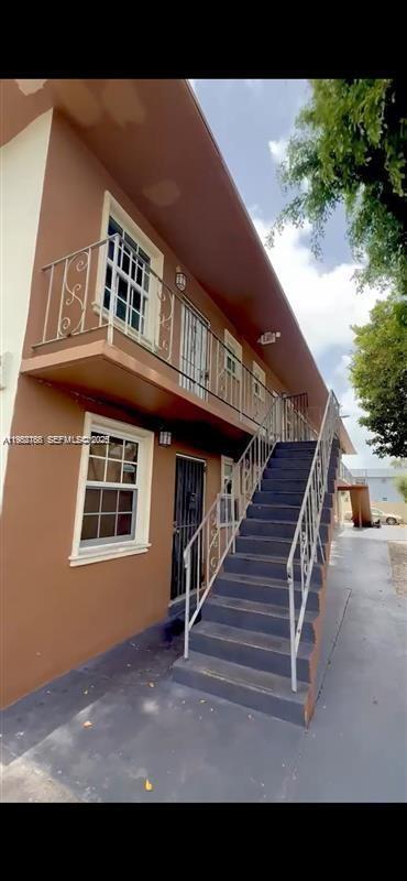 a view of a house with wooden stairs