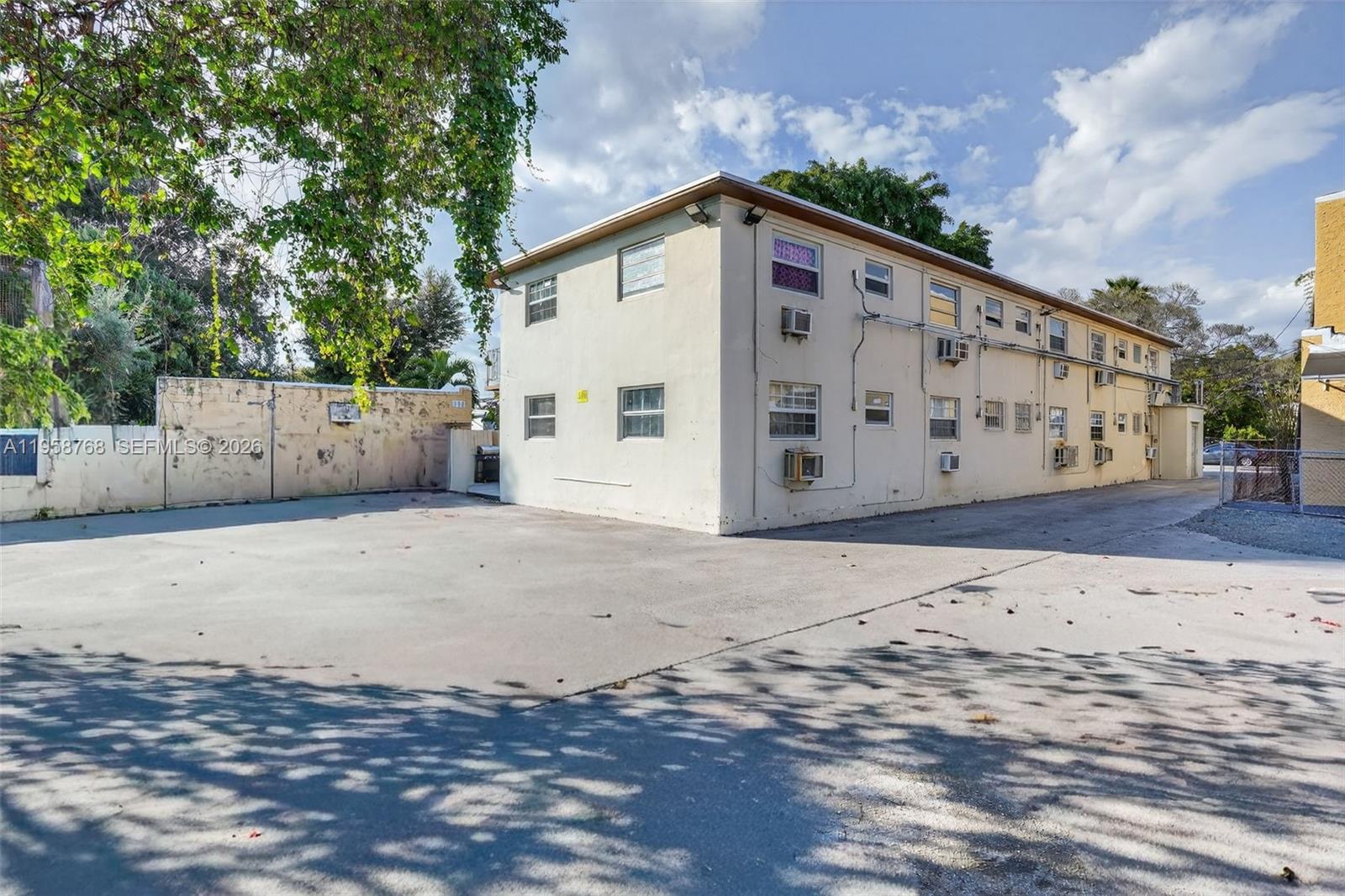 1736 Northwest 19th Street Miami, FL 33125 - Photo 7 of 17 a view of a house with a yard