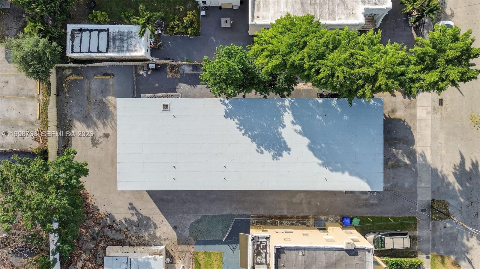 1736 Northwest 19th Street Miami, FL 33125 - Photo 10 of 17 an aerial view of a house with a yard and garden