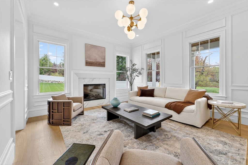 8 Crestview Road Needham, MA 02492 - Photo 24 of 30 a living room with furniture fireplace and a large window