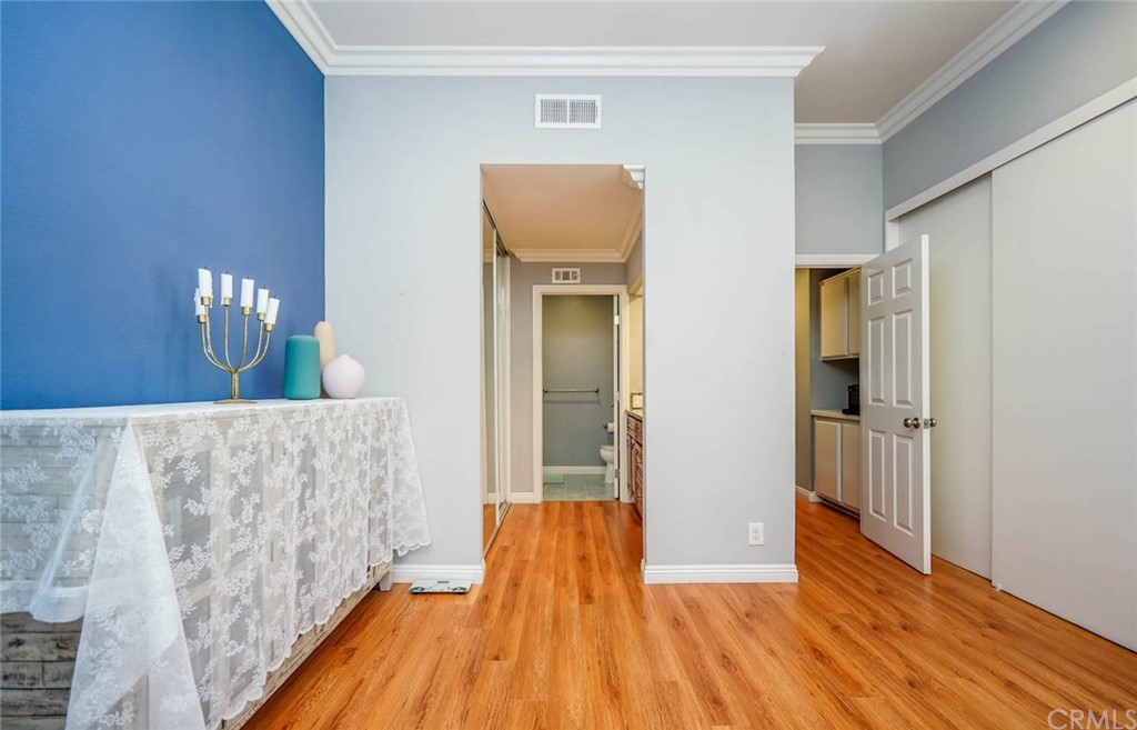 17 Filare Irvine, CA 92620 - Photo 15 of 46 a view of a hallway with wooden floor and staircase