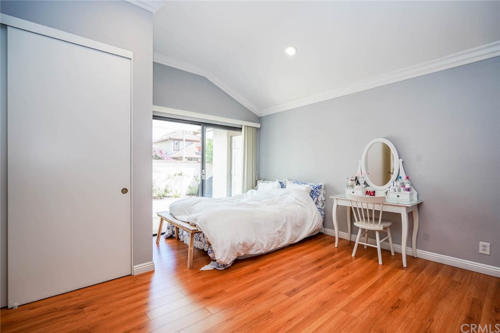 17 Filare Irvine, CA 92620 - Photo 16 of 46 a bedroom with a bed and a wooden floor