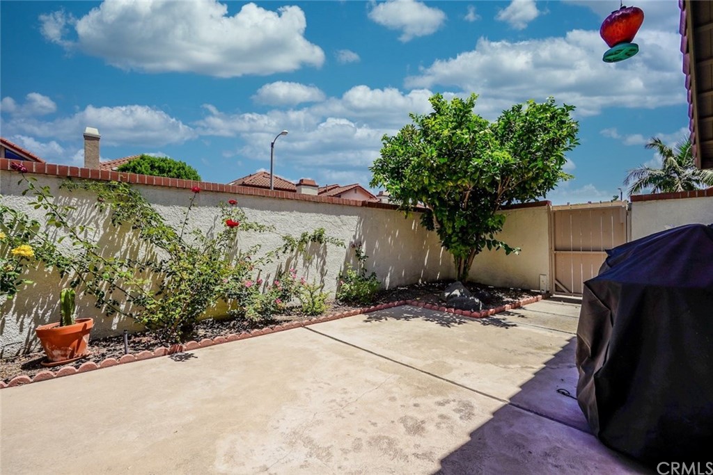 17 Filare Irvine, CA 92620 - Photo 28 of 46 a backyard of a house with lots of green space and glass windows