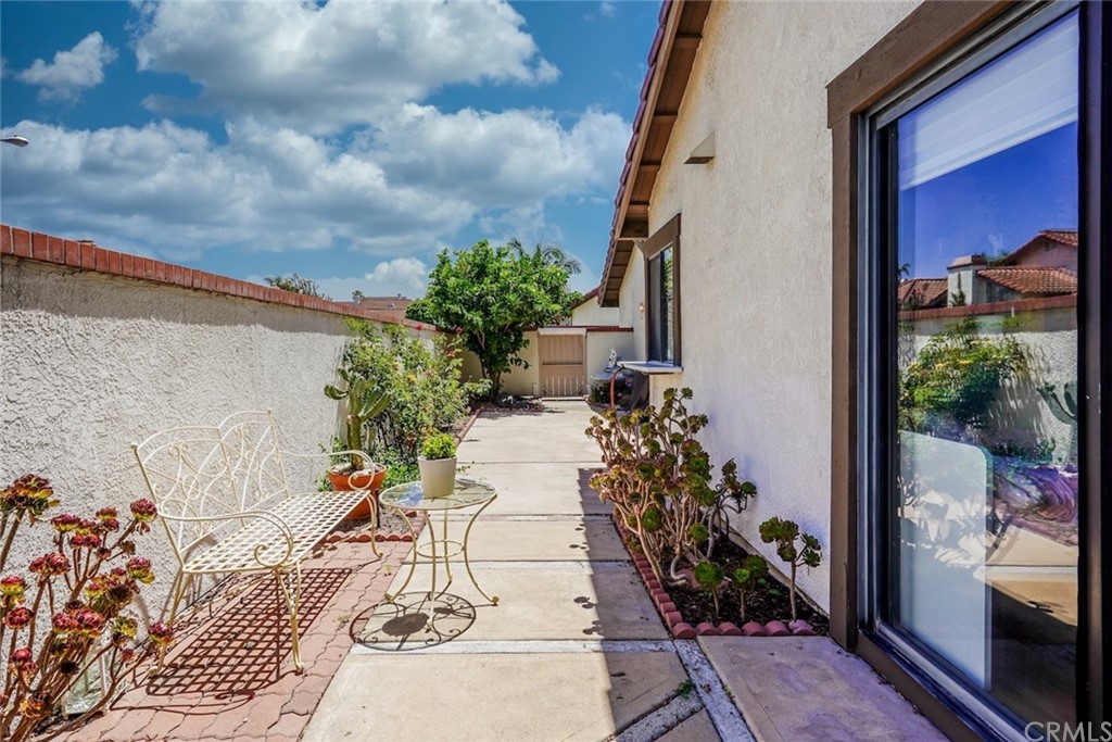 17 Filare Irvine, CA 92620 - Photo 32 of 46 a view of a porch with chairs and potted plants