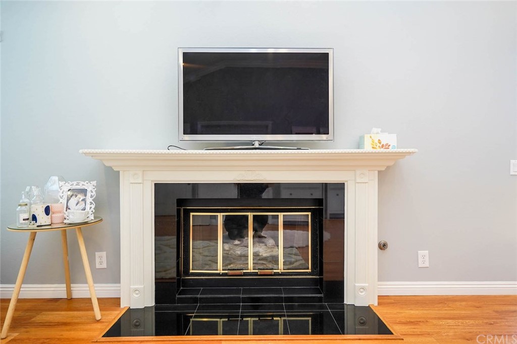 17 Filare Irvine, CA 92620 - Photo 4 of 46 a living room with a fireplace and a flat screen tv