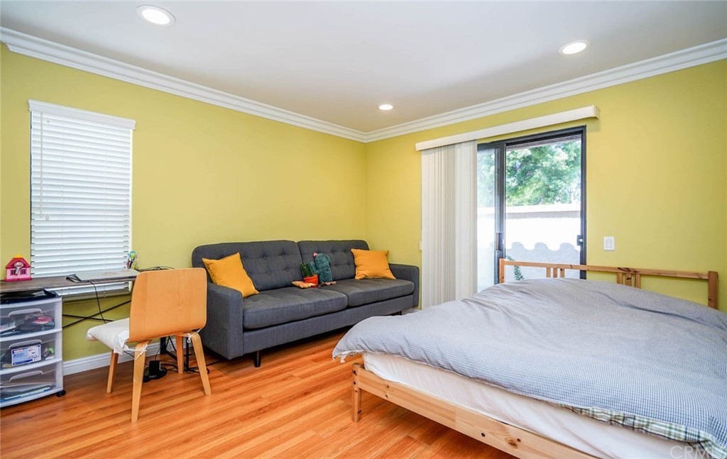 17 Filare Irvine, CA 92620 - Photo 9 of 46 a bedroom with a bed and wooden floor