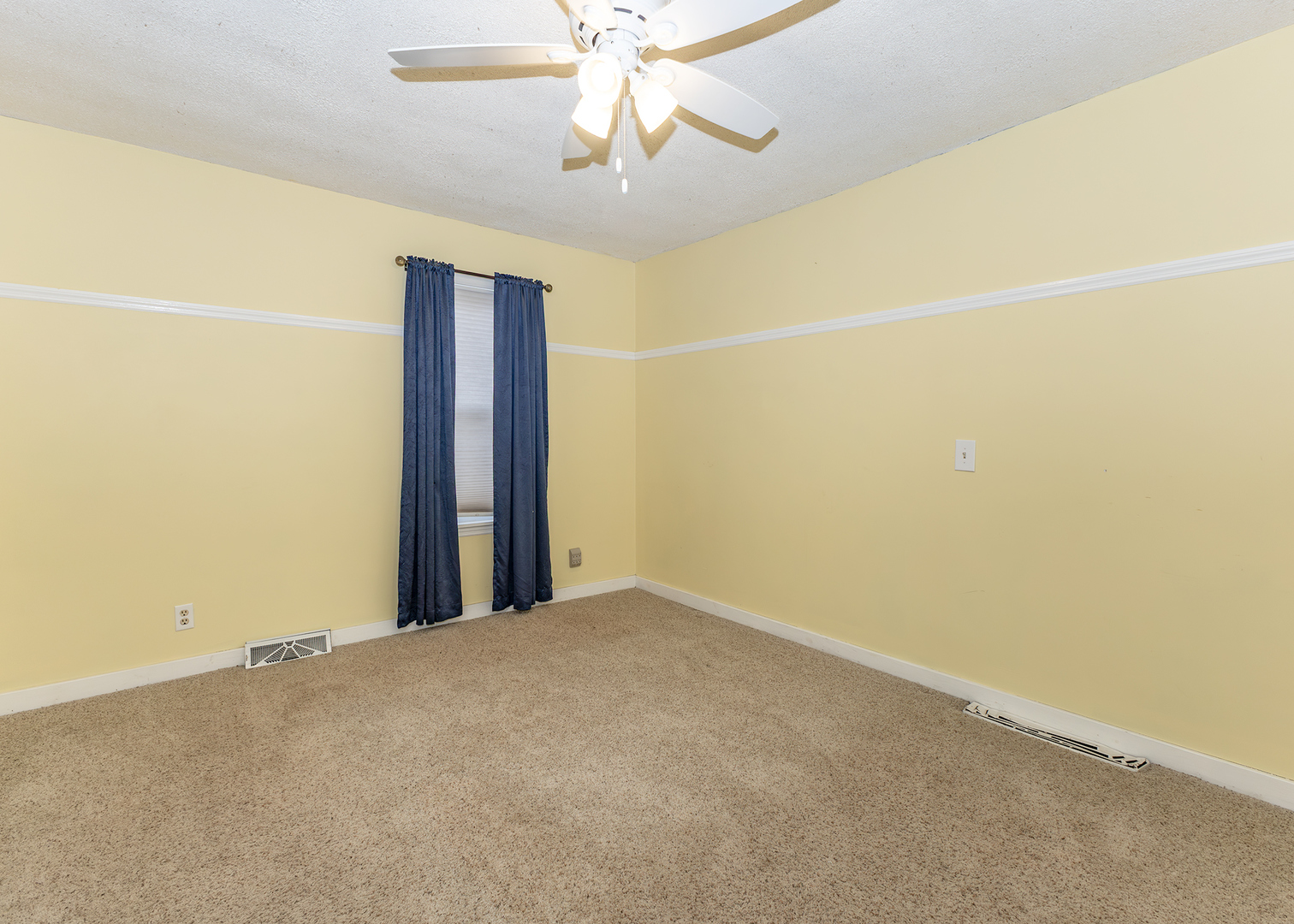 227 East 2nd Street Mineral, IL 61344 - Photo 18 of 28 an empty room with a chandelier fan and a chandelier fan