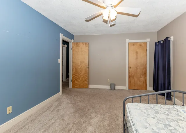a view of room with a ceiling fan