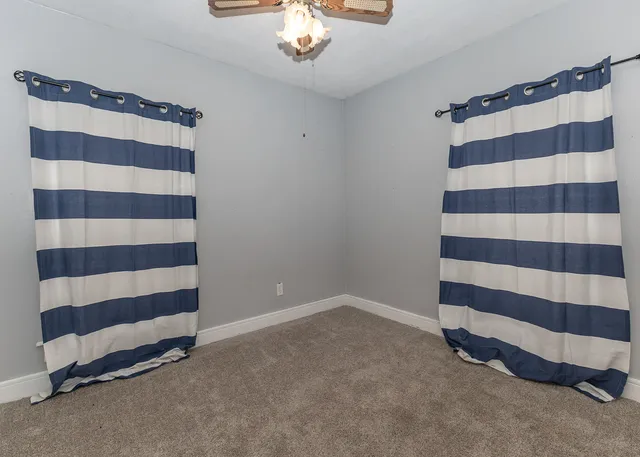 a view of a room with a black and white checkered floor