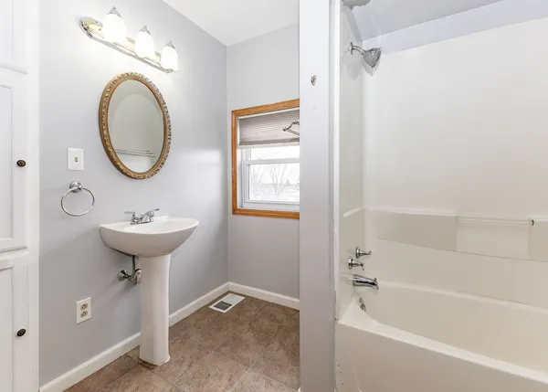 a bathroom with a sink a toilet and a bathtub