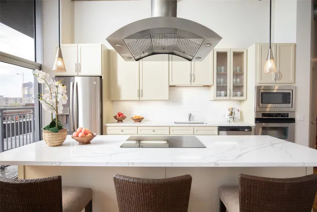 a kitchen with a table and chairs in it