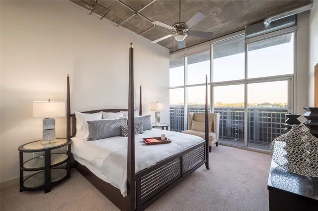 a kitchen with stainless steel appliances granite countertop a sink and a refrigerator