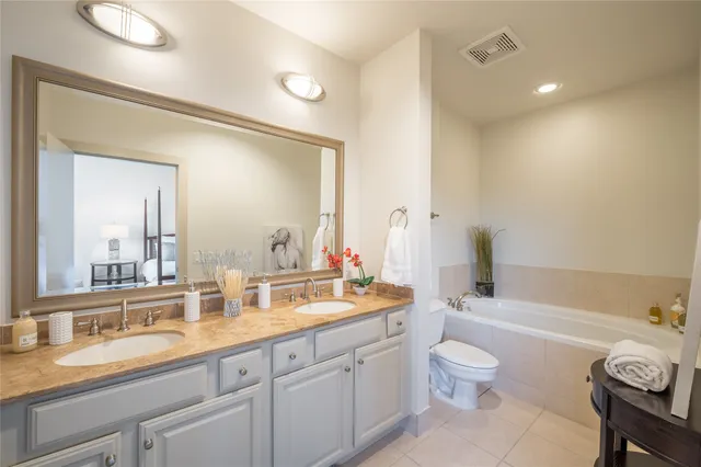 a bathroom with a sink vanity and a mirror