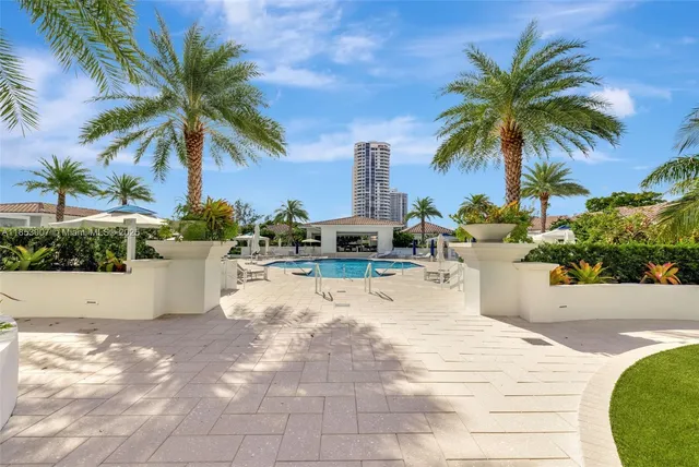 a view of a swimming pool with a lounge chair