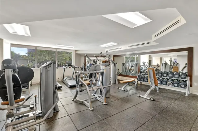 a large white kitchen with a window