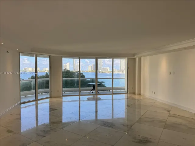 a view of a room with sliding glass door and mountain view