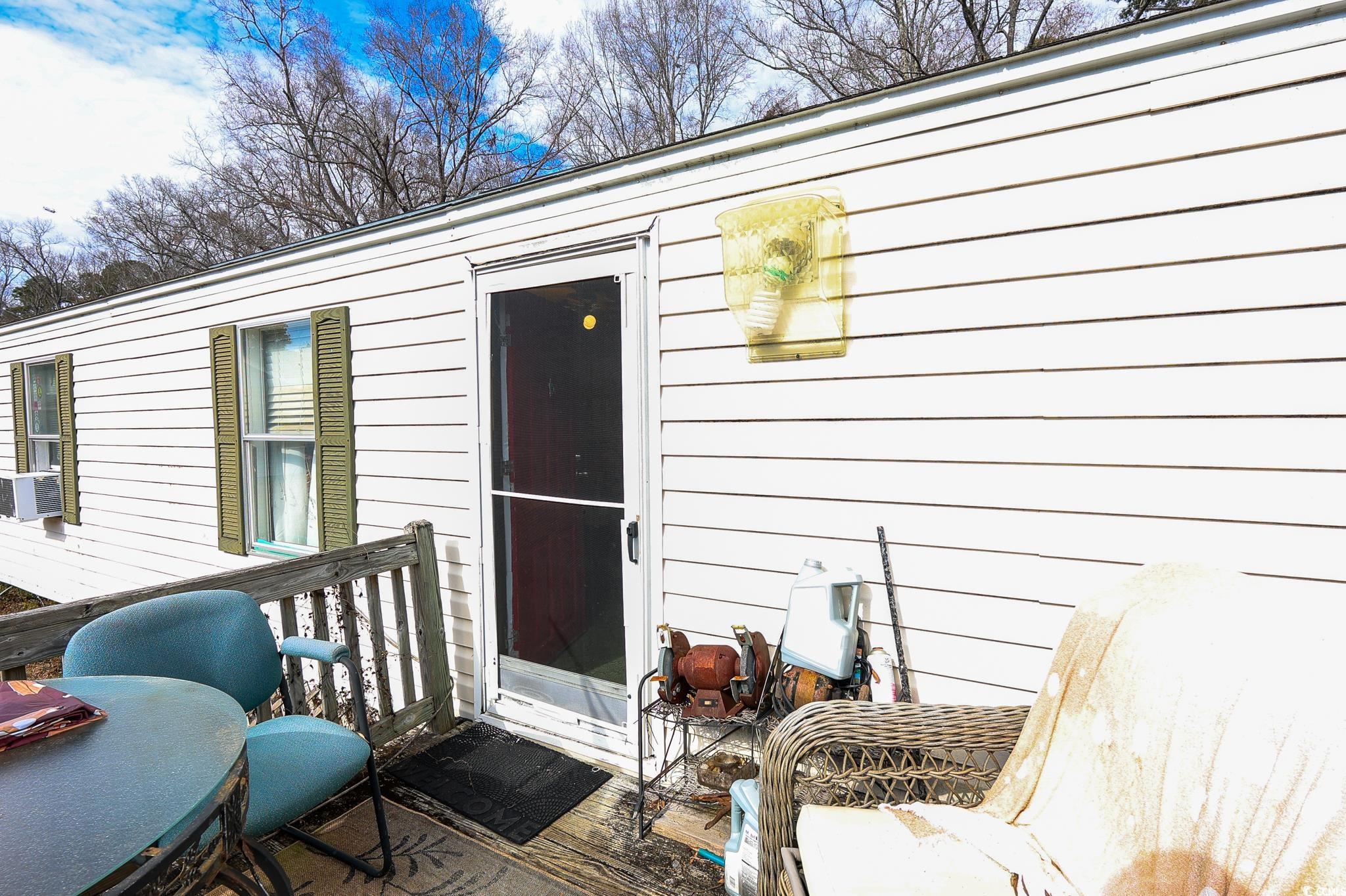 5266 Highmarket Street Georgetown, SC 29440 - Photo 15 of 17 View of exterior entry with cooling unit
