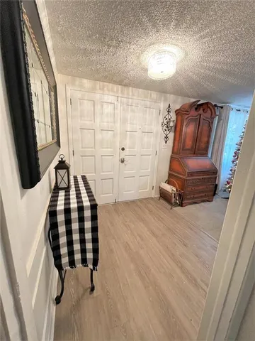 a view of a livingroom with furniture and staircase