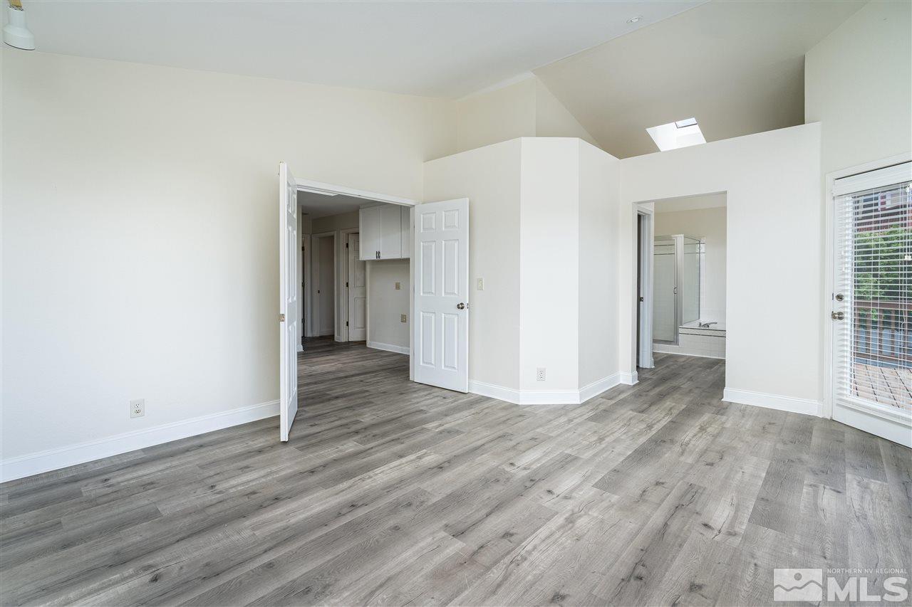 6284 Sunrise Meadows Loop Reno, NV 89519 - Photo 13 of 18 an empty room with wooden floor & windows and bathroom